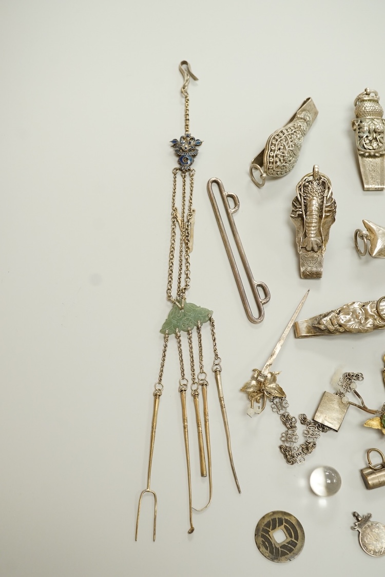 A collection of Chinese Straits white metal hooks, a chatelaine, South East Asian coinage and other items, etc.